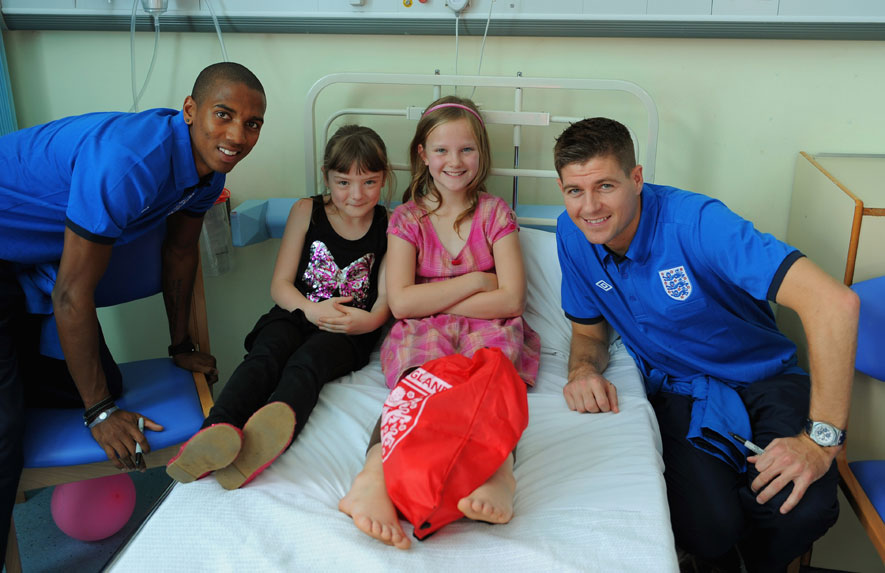 Ashley Young and Steven Gerrard pose for a photograph at Watford General.
